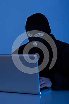 Criminal Using Laptop To Hack Online Account