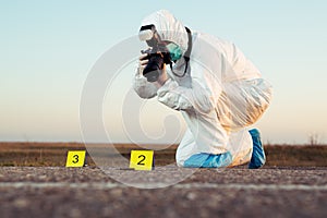 Criminological expert collecting evidence at the crime scene.