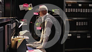 Criminologist looks at clues board