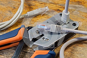 Crimping tool for mounting of the connectors RJ45 on the desktop in a workshop