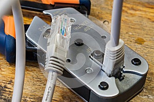 Crimping tool for mounting of the connectors RJ45 on the desktop in a workshop