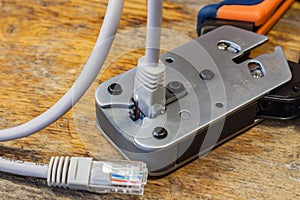 Crimping tool for mounting of the connectors RJ45 on the desktop in a workshop