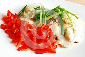 Crimson fish with paprika, celery and onion