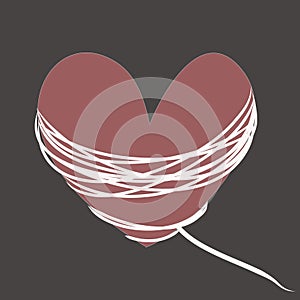 Crimson heart with white rope on gray background