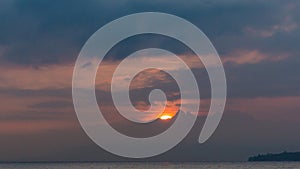 Crimson Sunrise behind Clouds and Alps Mountains and Lake Leman