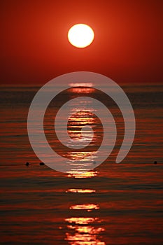 Crimson sunrise, seascape close-up. Mediterranean Sea. Kemer, Turkey