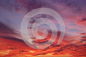 The crimson sunset and amazing clouds in the sky.