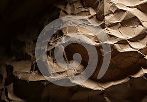 Crinkled paper texture with dramatic lighting and shadows