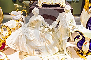 Cavalier and lady white figurines on display Meissen porcelain museum Germany