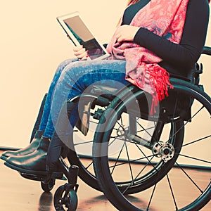 Crippled person with tablet.