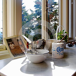 Antique kitchen display with Crisco, mixing bowl, recipe book