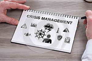 Crisis management concept on a notepad