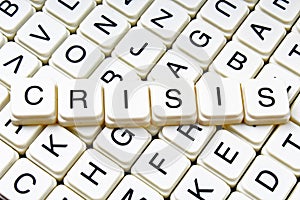 Crisis title text word crossword. Alphabet letter blocks game texture background. White alphabetical letters on black
