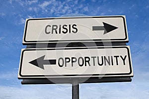 Crisis vs opportunity. White two street signs with arrow on metal pole with words. Directional road. Crossroads Road Sign, Two