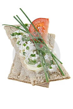 Crisp bread with cottage cheese tomato and chives