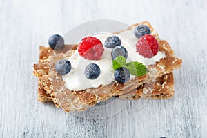 Crisp bread with creme fraiche and berries