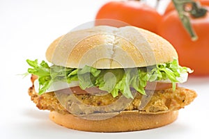 Crisp chicken burger tomato onion cheese lettuce