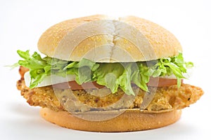 Crisp chicken burger tomato onion cheese lettuce