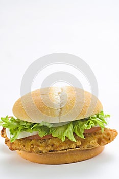 Crisp chicken burger tomato onion cheese lettuce