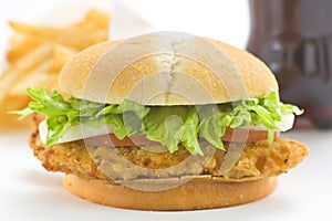 Crisp chicken burger tomato onion cheese lettuce