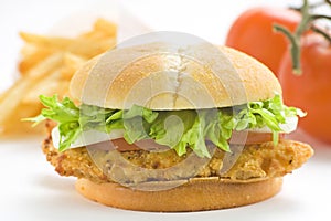 Crisp chicken burger tomato onion cheese lettuce