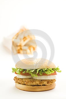 Crisp chicken burger tomato onion cheese lettuce