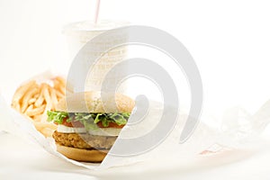 Crisp chicken burger tomato onion cheese lettuce