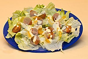 Crisp and fresh salad on plate with dressing