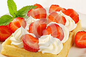 Crisp waffle with strawberries and cream