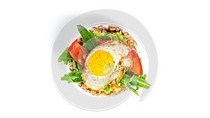 Crispbread sandwich with guacamole, arugula, tomatoes and quail egg isolated on a white background. Bruschetta with