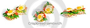 Crispbread sandwich with guacamole, arugula, tomatoes and quail egg isolated on a white background. Bruschetta with