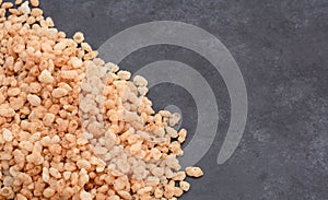 Crisped rice breakfast cereal on grey slate background