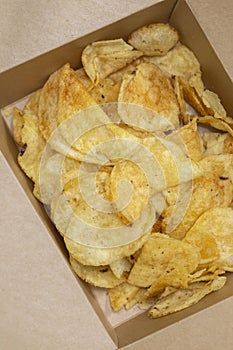 Crisps potato chips, salt and vinegar flavour, in a card carton box. Environmentally friendly biodegradable packaging