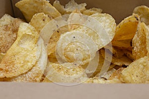 Crisps potato chips, salt and vinegar flavour, in a card carton box. Environmentally friendly biodegradable packaging