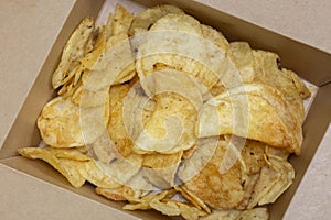 Crisps potato chips, salt and vinegar flavour, in a card carton box. Environmentally friendly food packaging