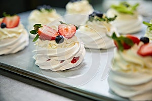 Crispy and airy meringue nests filled with fruit mousse