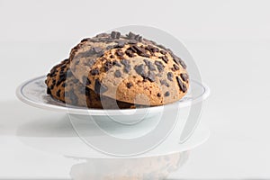 Crispy biscuits with chocolate flakes on white background