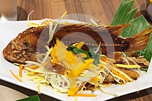 Crispy boneless fish with mango salad