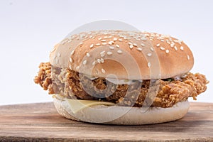 Crispy chicken burger with lettuce, cheese, and mayonnaise