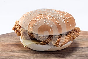 Crispy chicken burger with lettuce, cheese, and mayonnaise