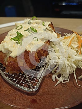 Crispy chicken katsu with coleslaw salad