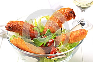 Crispy chicken tenders with salad