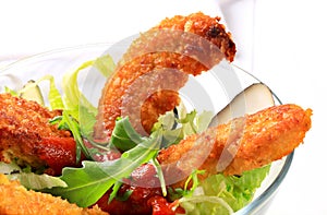 Crispy chicken tenders with salad