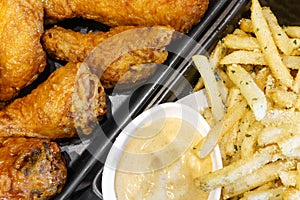 Crispy chicken wing with french fries