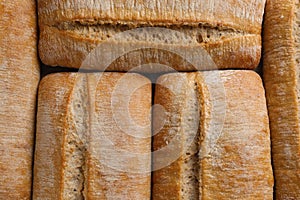 Crispy ciabattas as background, top view. Fresh bread