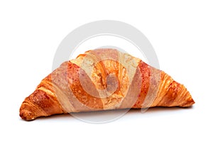 Crispy croissant on a white background close-up. Homemade baking