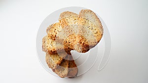 crispy croutons with poppy seeds on a white table surface