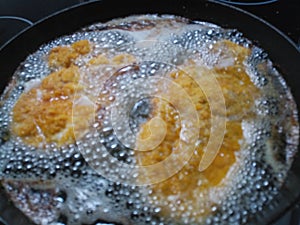 Crispy deep frying weiner schnitzel