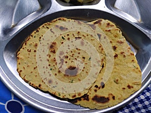 Crispy and delicious Gujarati flatbread- Thepla served on a plate