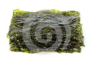 Crispy dried seaweed nori with salt isolated closeup.